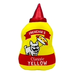 Żółta pluszowa zabawka w kształcie butelki musztardy z czerwoną nakrętką i wyszytym napisem ’frenchie’s classic yellow’ z rysunkowym psem.