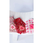 Three heart-shaped fabric patches with embroidered love messages on pink and red tweed backgrounds for chusta true love coco